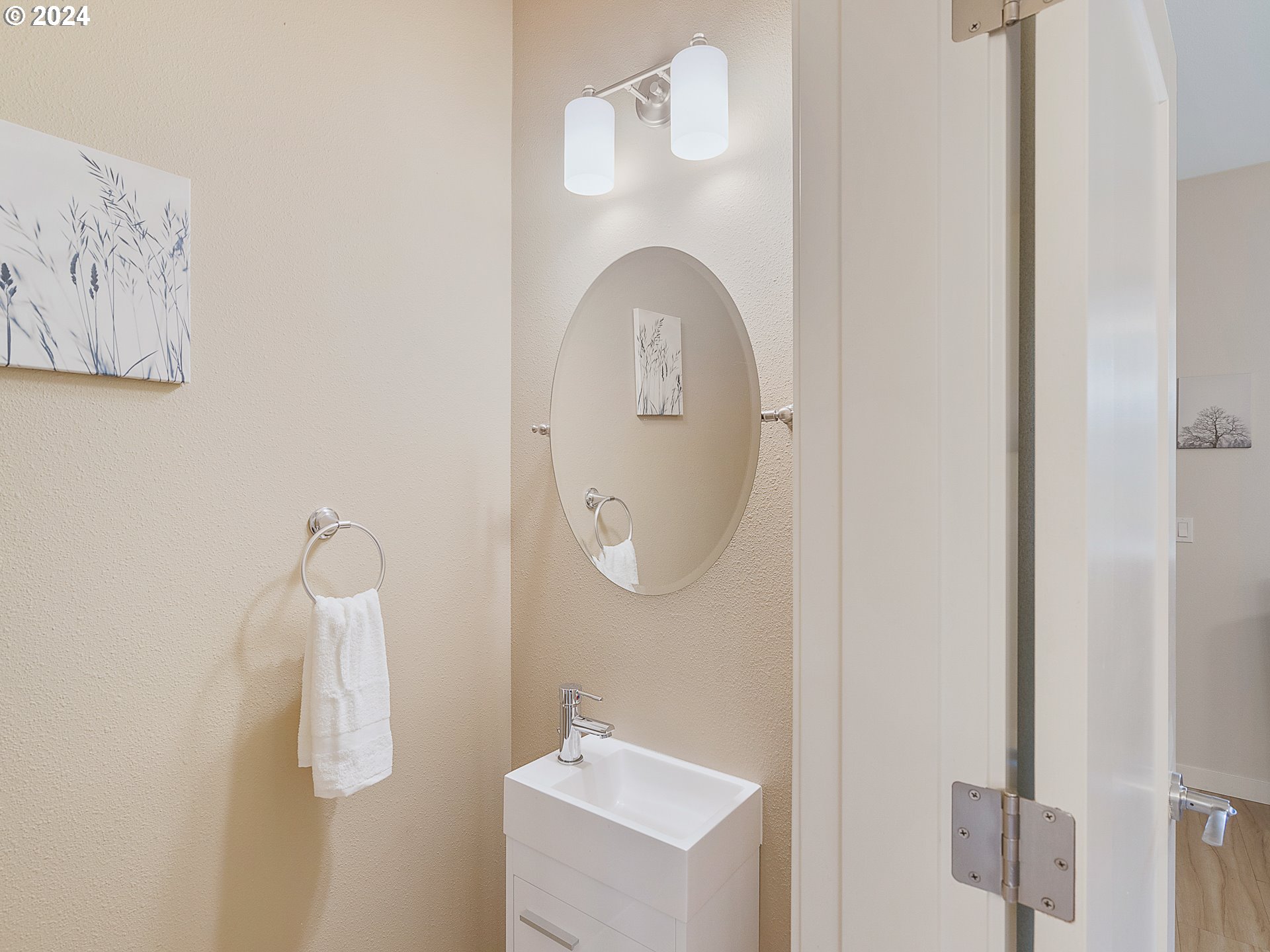 10827 East Burnside Street Portland, OR 97216 - Photo 8 of 28 a bathroom with a sink mirror and vanity