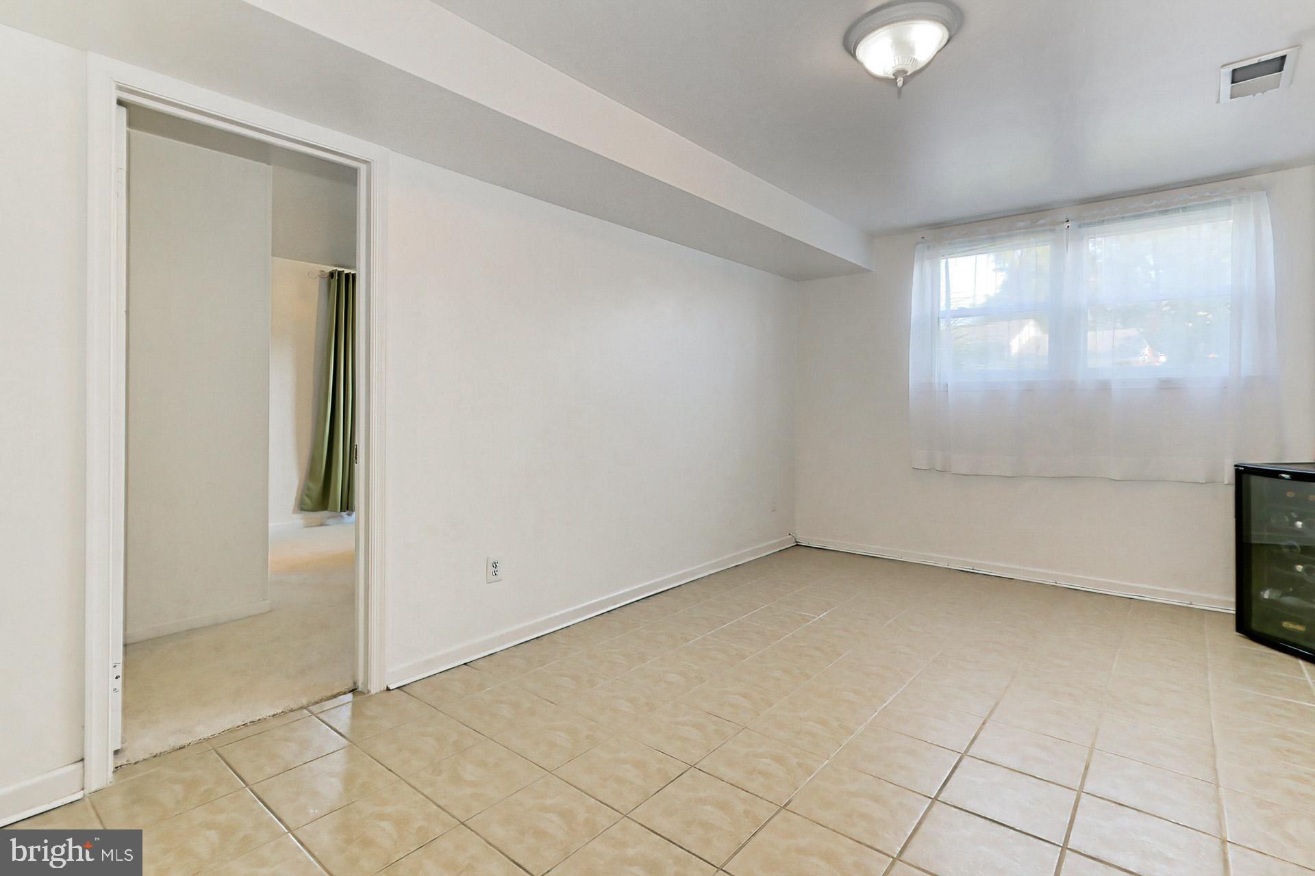 8139 Drayton Lane Springfield, VA 22151 - Photo 25 of 44 Lower Level Rec Room w/Ceramic Tile