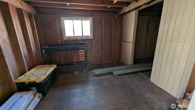 a room with chair and a wooden door