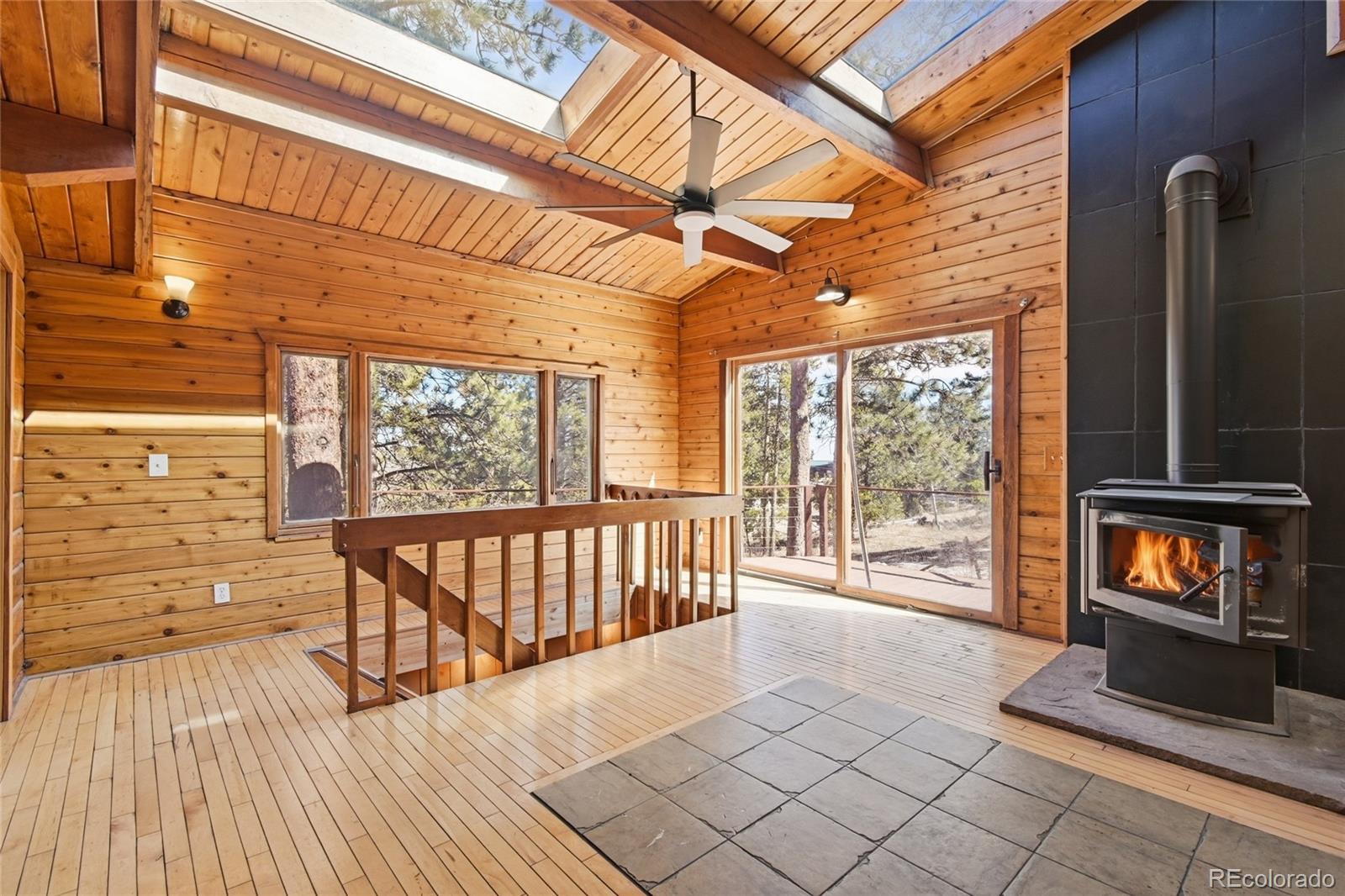 61 Ramona Road Golden, CO 80403 - Photo 12 of 49 a view of porch with a door and wooden floor