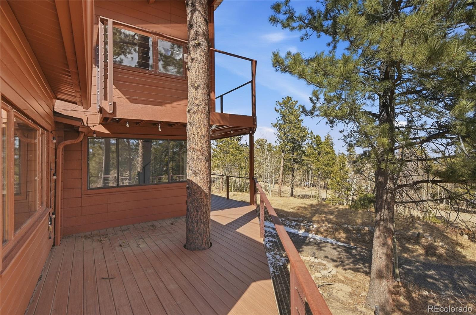 61 Ramona Road Golden, CO 80403 - Photo 2 of 49 a view of balcony with wooden floor and fence