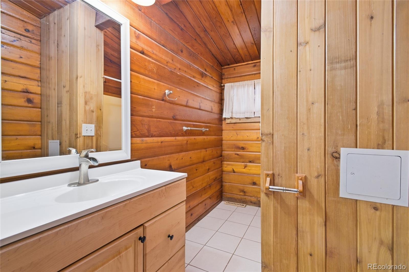 61 Ramona Road Golden, CO 80403 - Photo 22 of 49 a bathroom with a sink and a shower