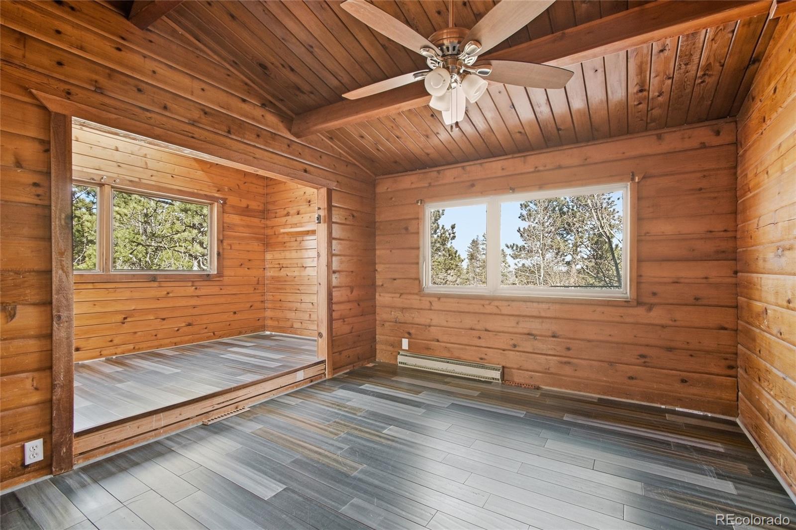 61 Ramona Road Golden, CO 80403 - Photo 24 of 49 a view of livingroom with wooden floor and window