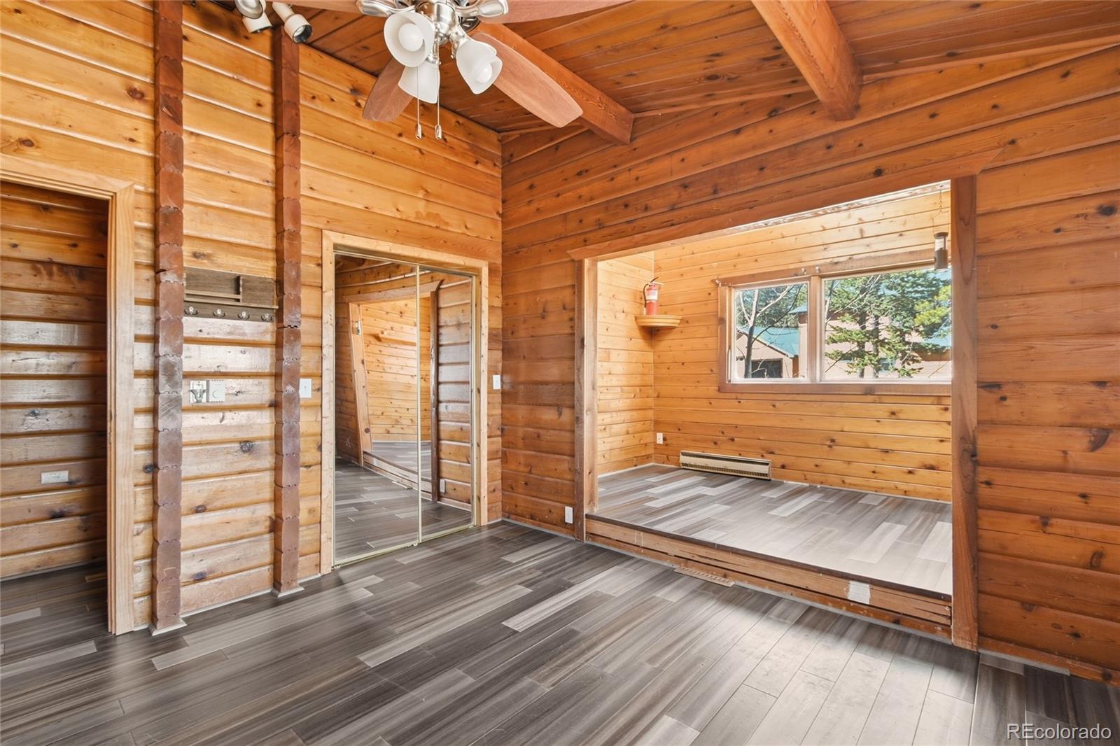 61 Ramona Road Golden, CO 80403 - Photo 25 of 49 a view of a room with wooden floor and windows
