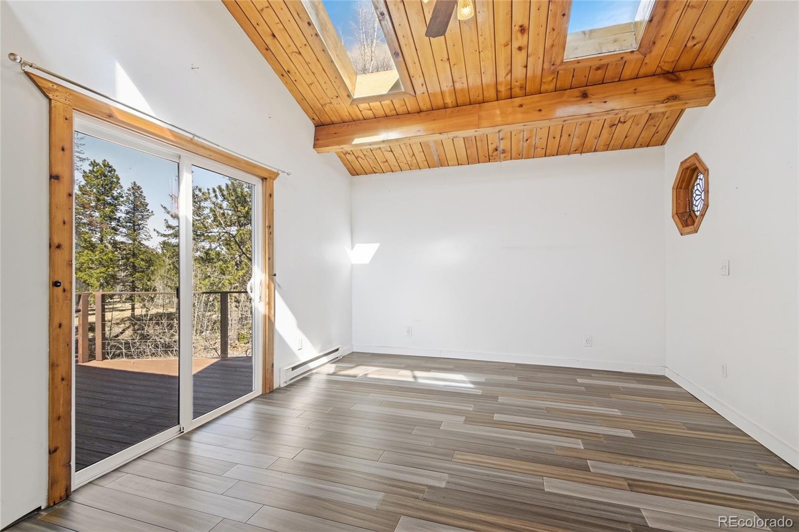 61 Ramona Road Golden, CO 80403 - Photo 27 of 49 a view of a room with wooden floor and fan