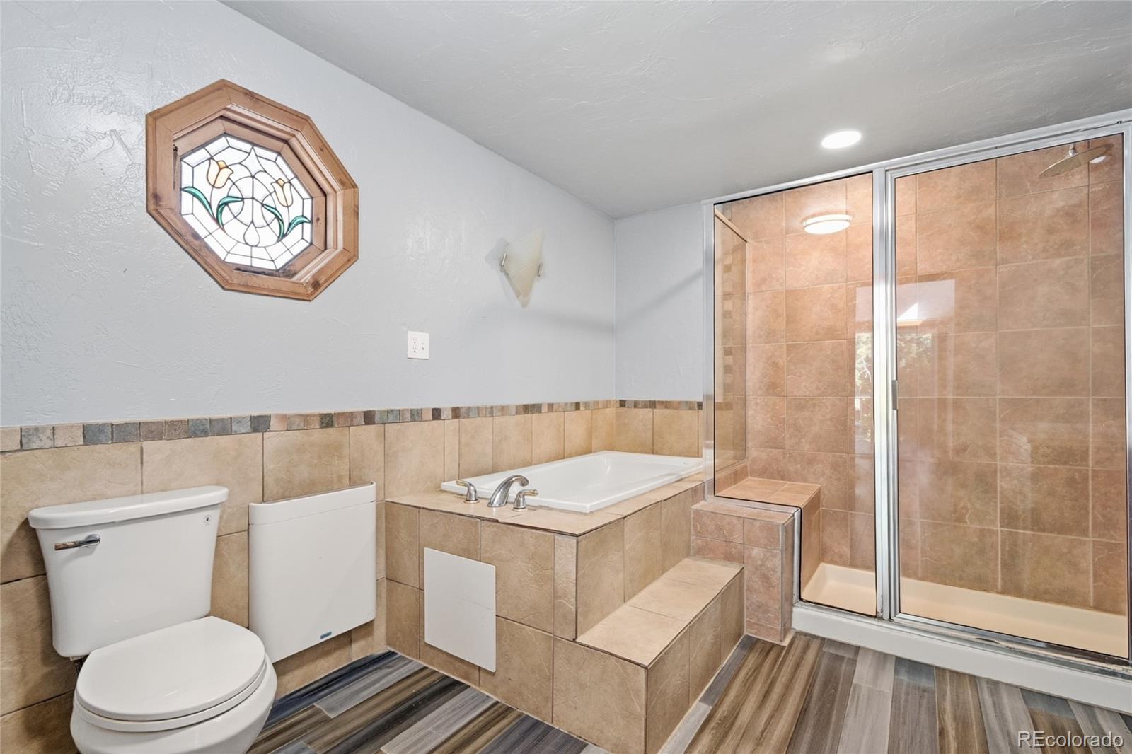61 Ramona Road Golden, CO 80403 - Photo 30 of 49 a bathroom with a sink and a large mirror