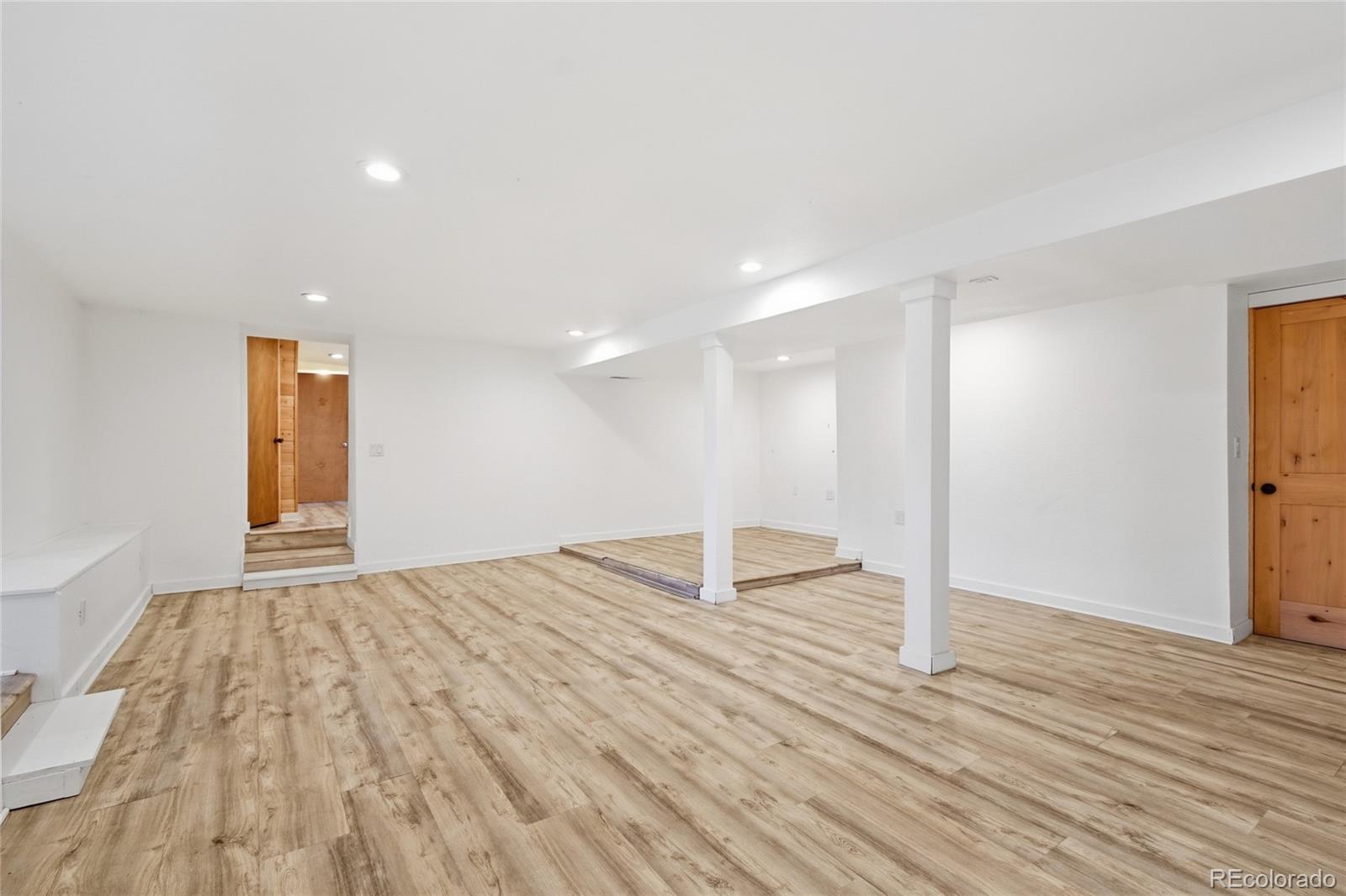 61 Ramona Road Golden, CO 80403 - Photo 33 of 49 a view of empty room with wooden floor