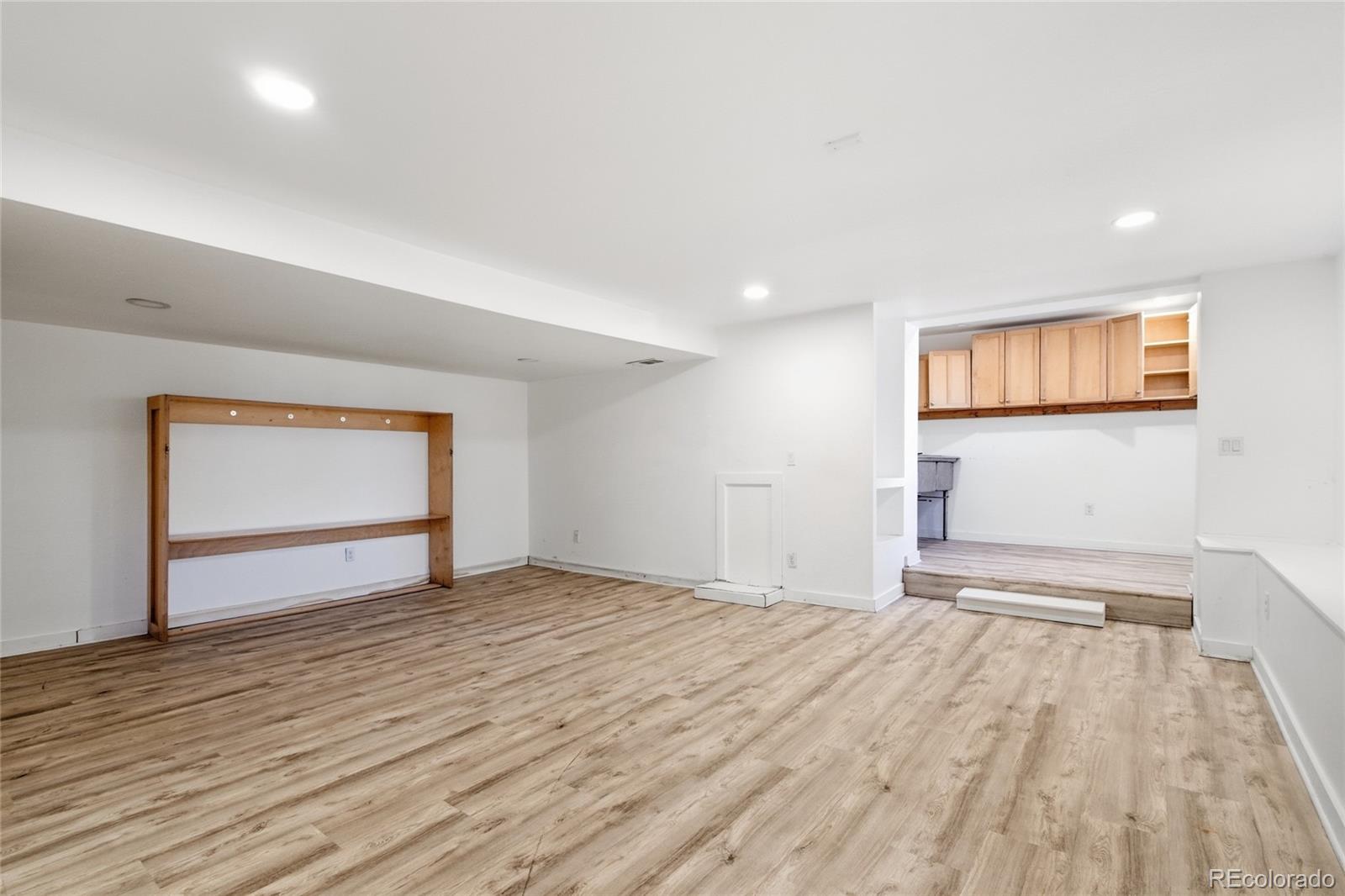 61 Ramona Road Golden, CO 80403 - Photo 37 of 49 a view of empty room with wooden floor and fan