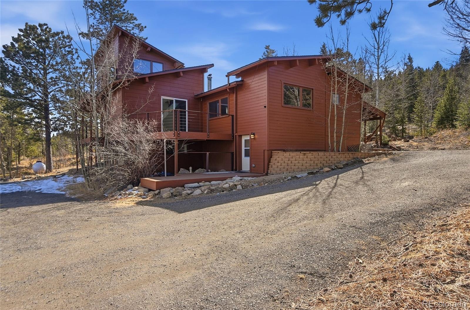 61 Ramona Road Golden, CO 80403 - Photo 41 of 49 a view of a house with a yard