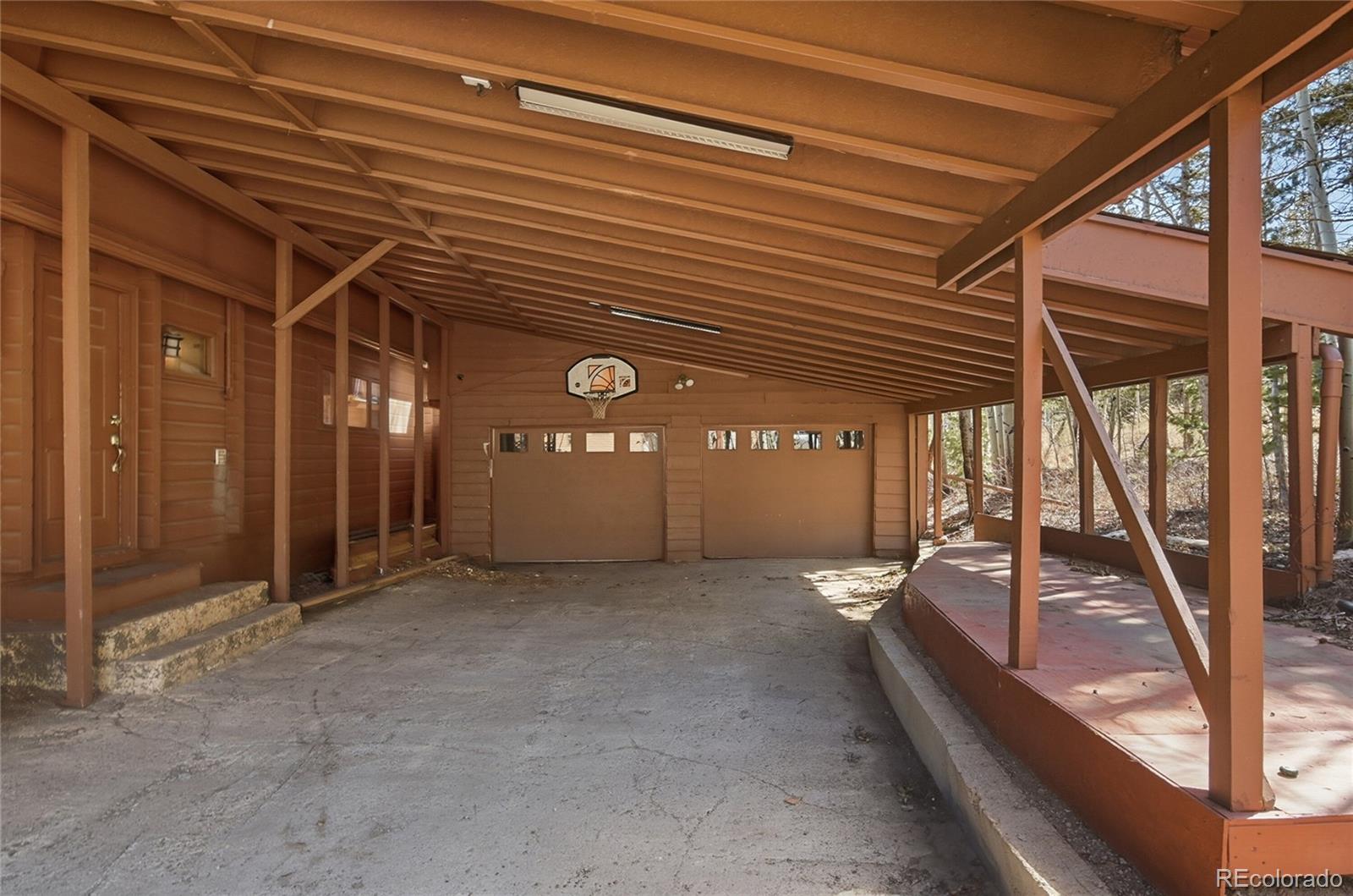 61 Ramona Road Golden, CO 80403 - Photo 43 of 49 a view of a porch with furniture and stairs