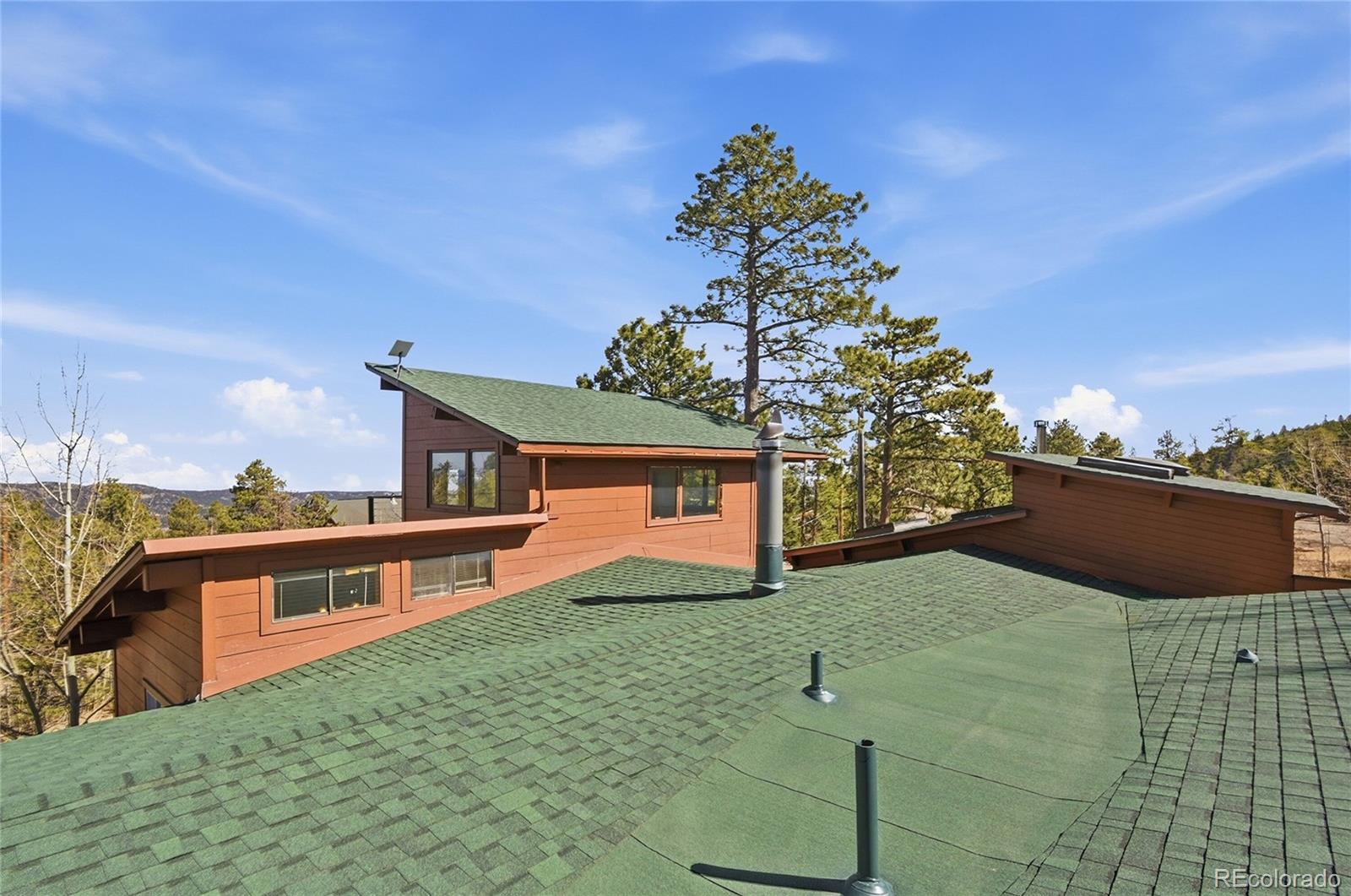 61 Ramona Road Golden, CO 80403 - Photo 45 of 49 a front view of a house with garden