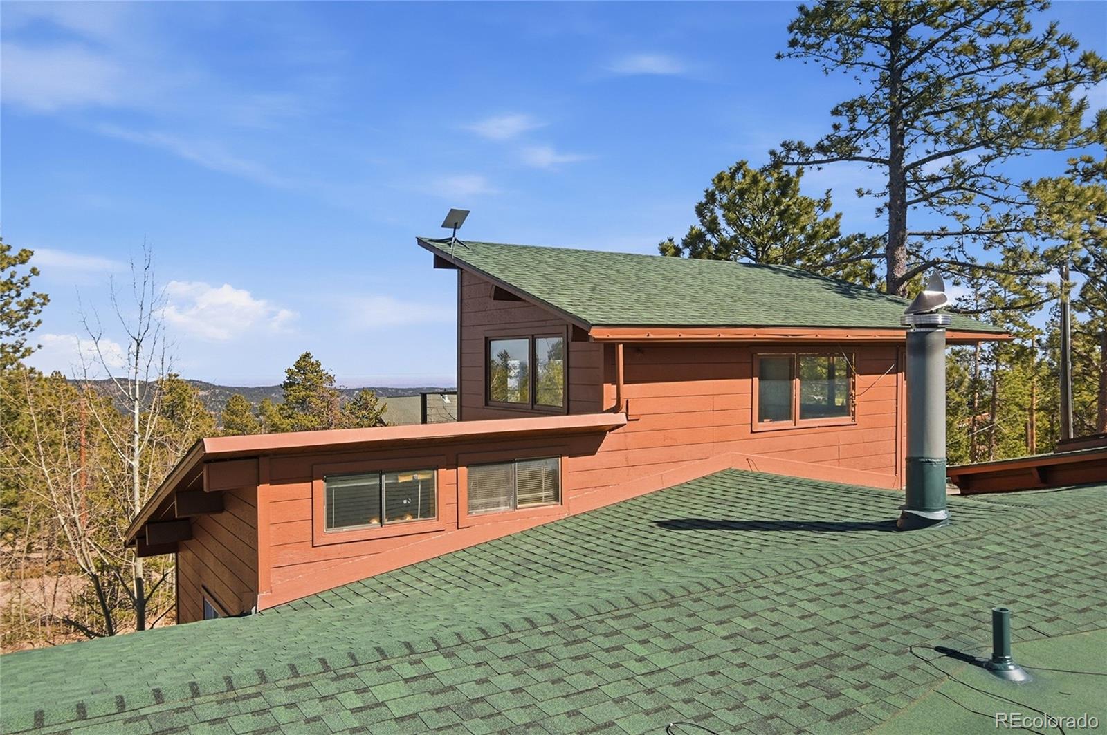 61 Ramona Road Golden, CO 80403 - Photo 46 of 49 a front view of a house with a yard