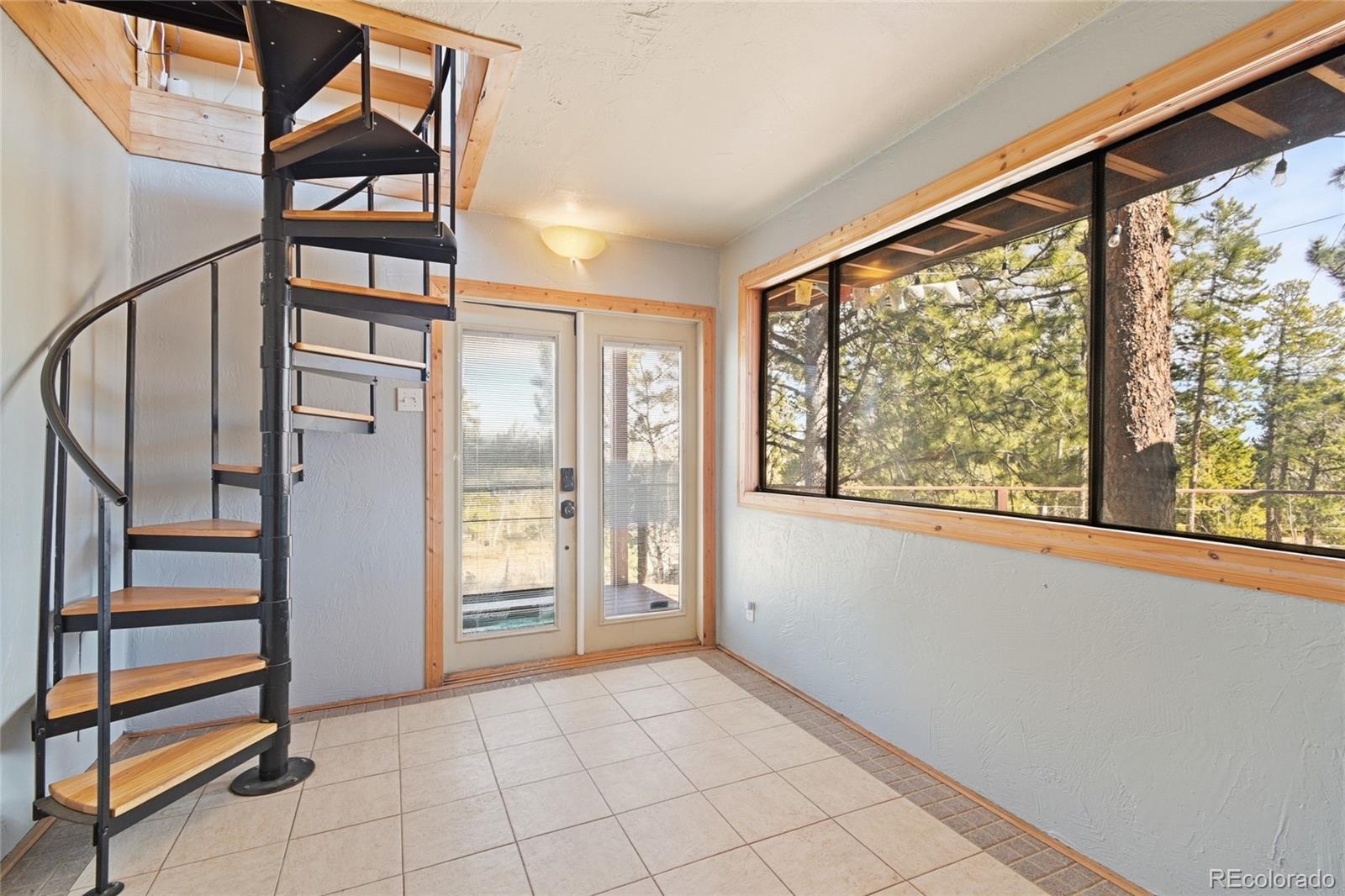 61 Ramona Road Golden, CO 80403 - Photo 5 of 49 a view of entryway with stairs and furniture