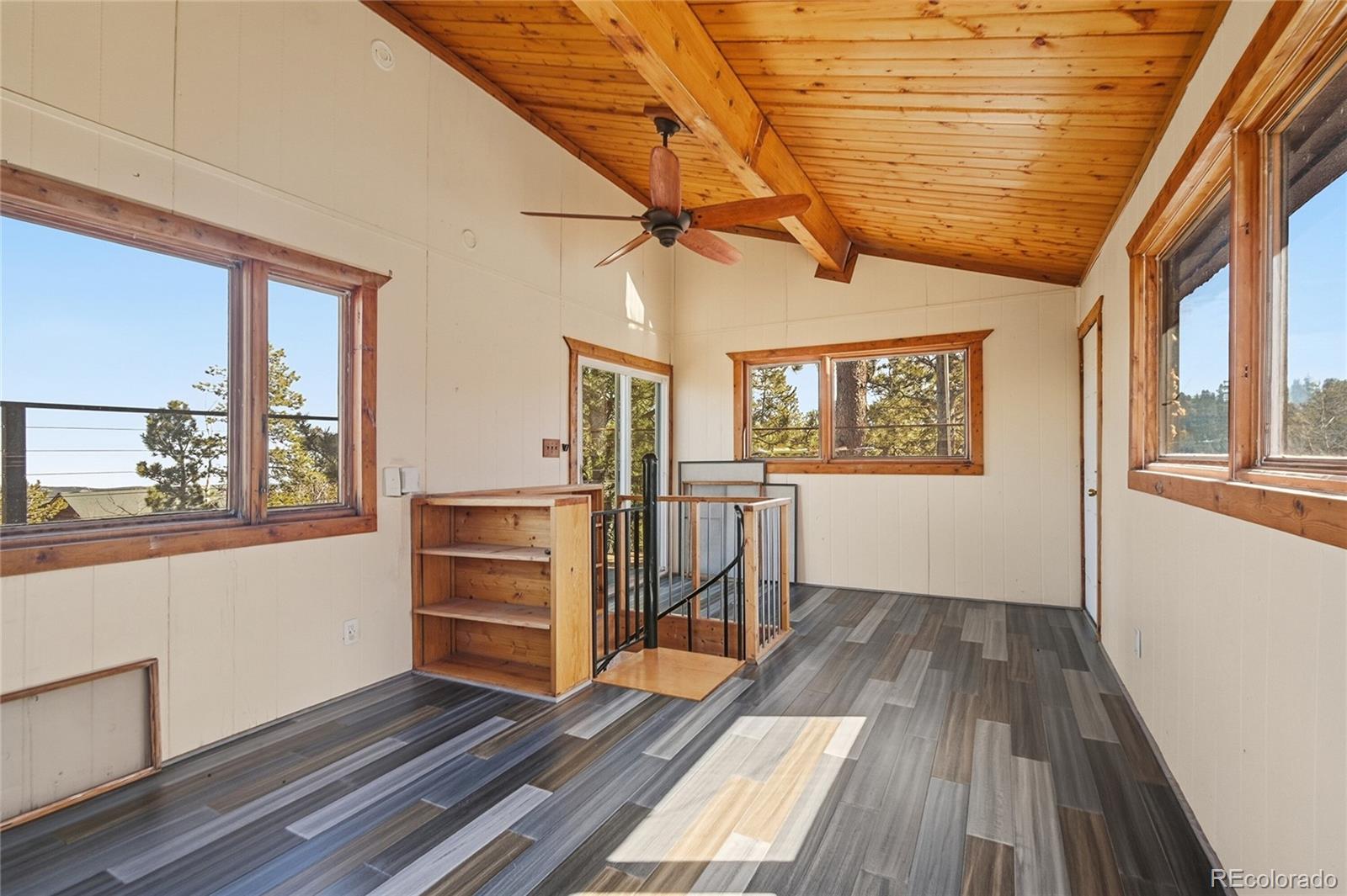 61 Ramona Road Golden, CO 80403 - Photo 7 of 49 a view of a room with wooden floor and windows