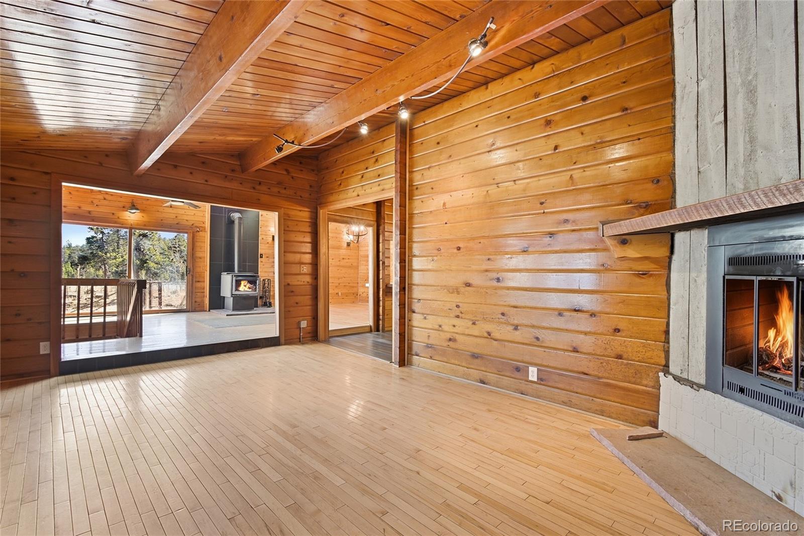 61 Ramona Road Golden, CO 80403 - Photo 10 of 49 a view of empty room with wooden floor and fan