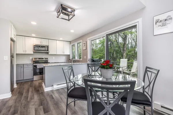 a view of a dining room with furniture window and outside view
