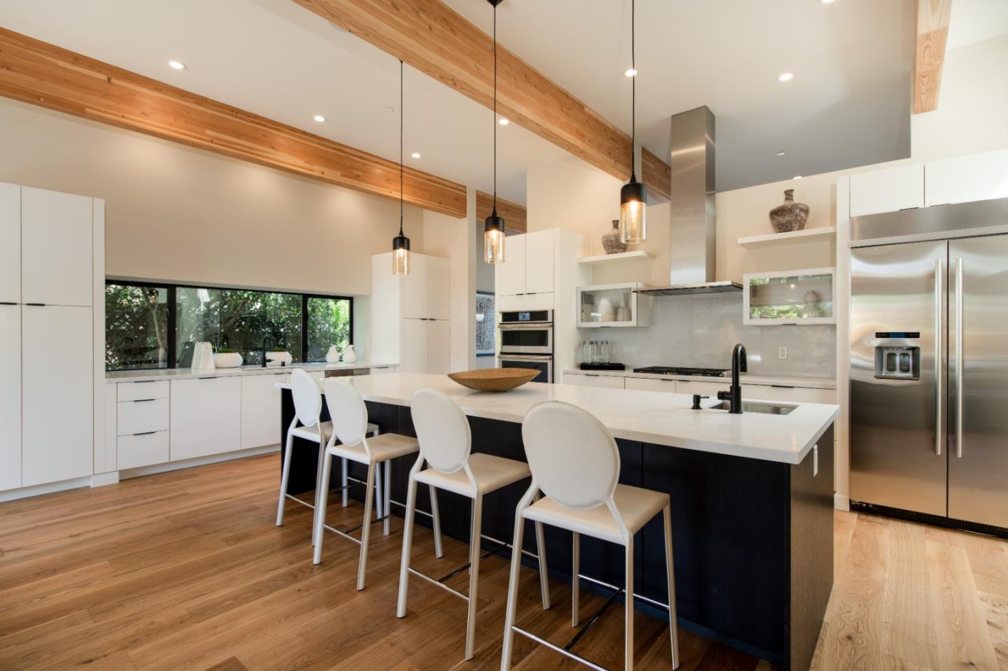 1617 Corte Via Los Altos, CA 94024 - Photo 12 of 27 a kitchen with stainless steel appliances kitchen island granite countertop a table chairs sink and cabinets