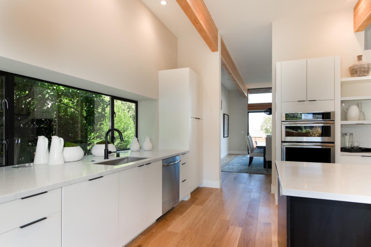1617 Corte Via Los Altos, CA 94024 - Photo 13 of 27 a kitchen with stainless steel appliances a counter top space cabinets and a large window