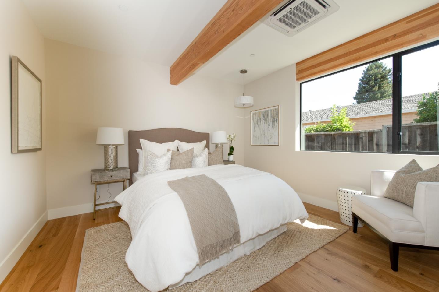 1617 Corte Via Los Altos, CA 94024 - Photo 19 of 27 a bedroom with a bed and a large window