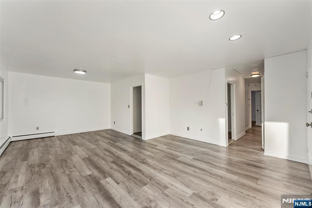 1 Dunn Road West Orange, NJ 07052 - Photo 4 of 20 a view of an empty room with wooden floor
