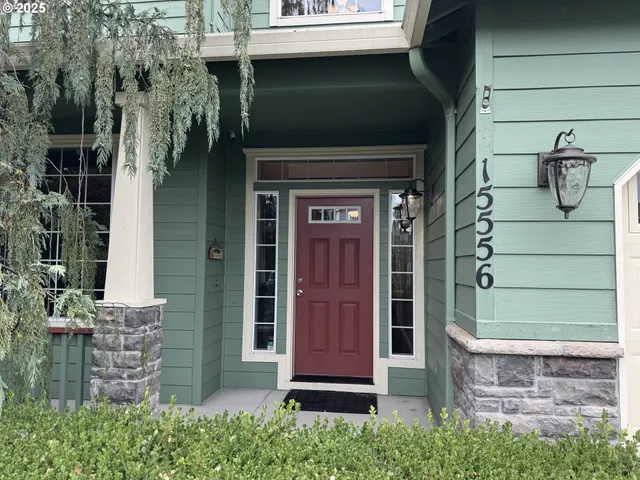 front door of a house with potted plants