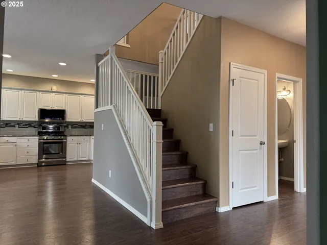 a view of a kitchen with a sink and cabinets