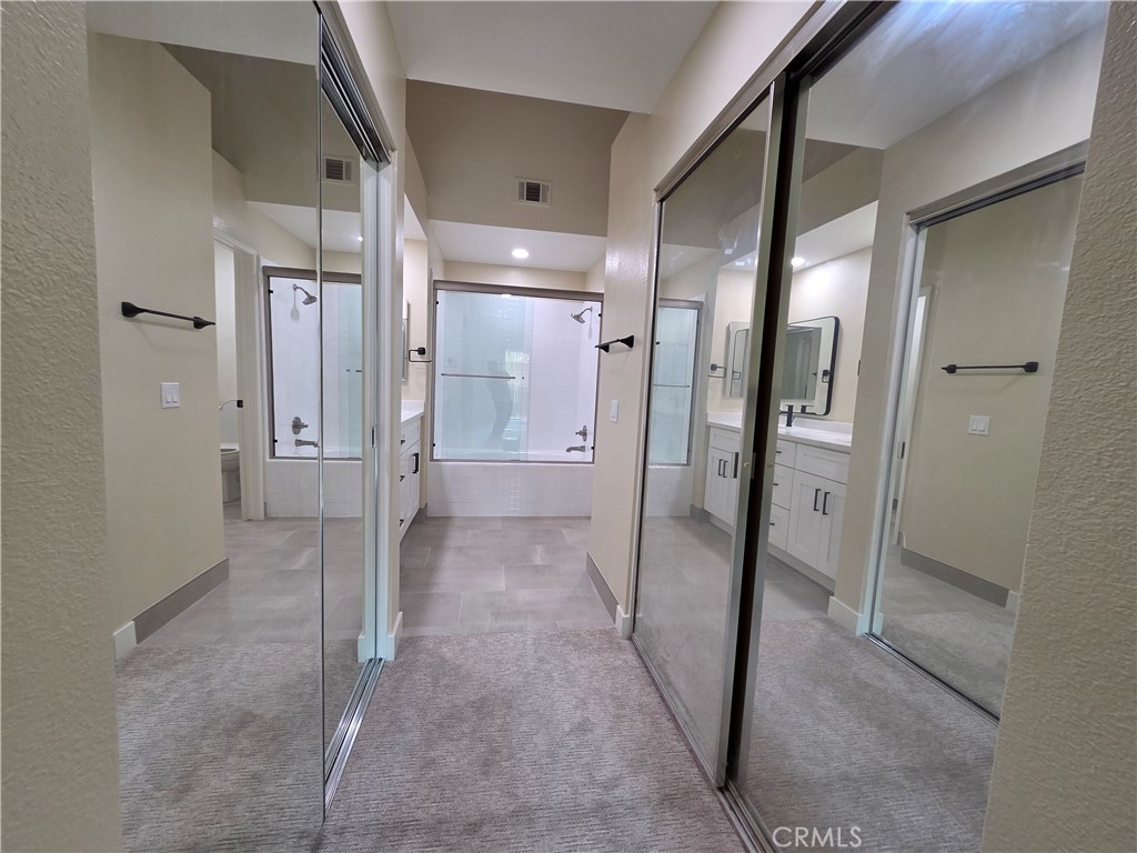 35 Ericson Aisle Irvine, CA 92620 - Photo 11 of 21 a bathroom with a glass door shower