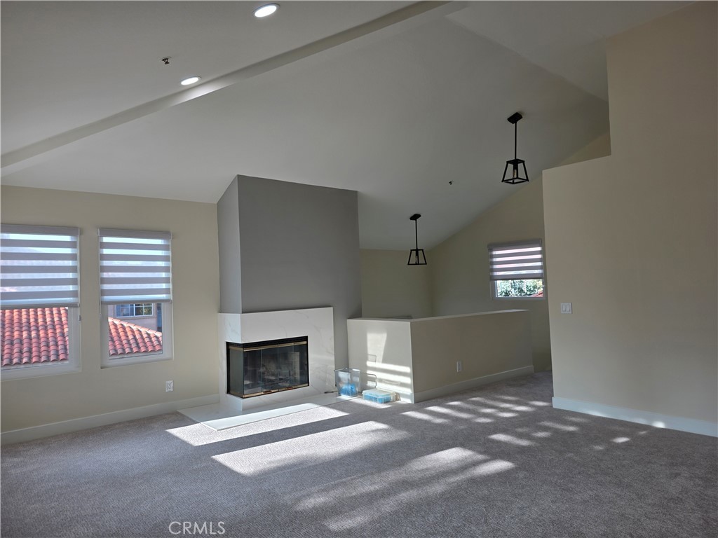 35 Ericson Aisle Irvine, CA 92620 - Photo 3 of 21 a view of empty room with a fireplace
