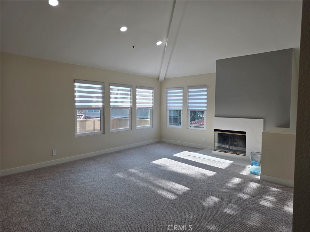 35 Ericson Aisle Irvine, CA 92620 - Photo 4 of 21 a view of an empty room with a window and fireplace