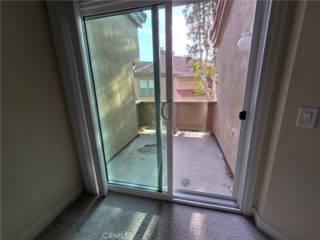 35 Ericson Aisle Irvine, CA 92620 - Photo 9 of 21 an empty room with wooden floor and windows