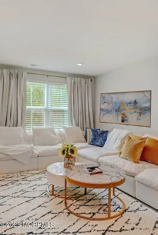 a bedroom with a bed and a television