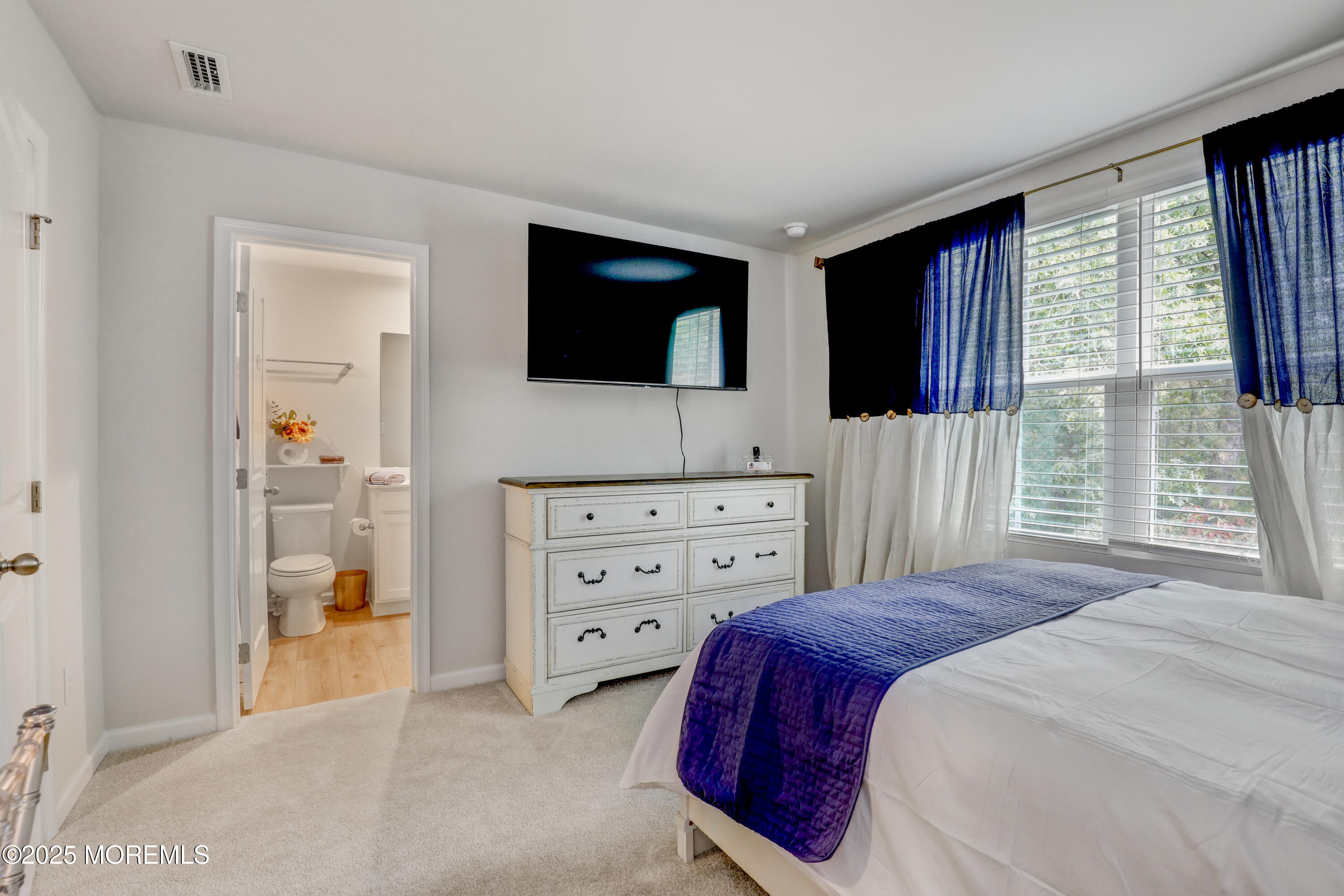 1001 Cypress Street Forked River, NJ 08731 - Photo 13 of 26 a bedroom with a bed and a television