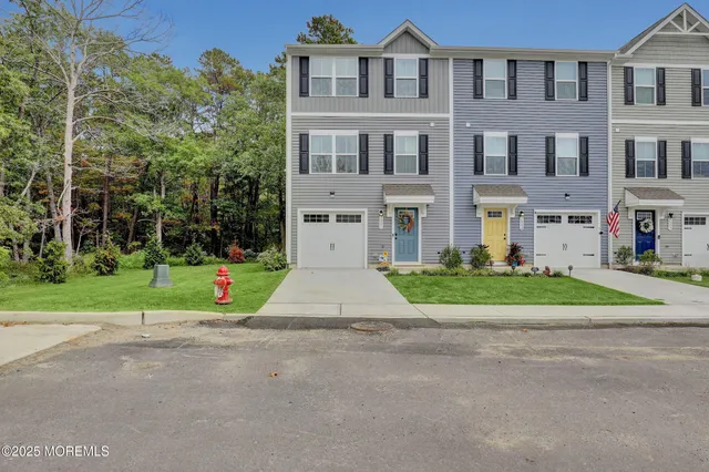 a very nice looking room with wooden floor and entryway