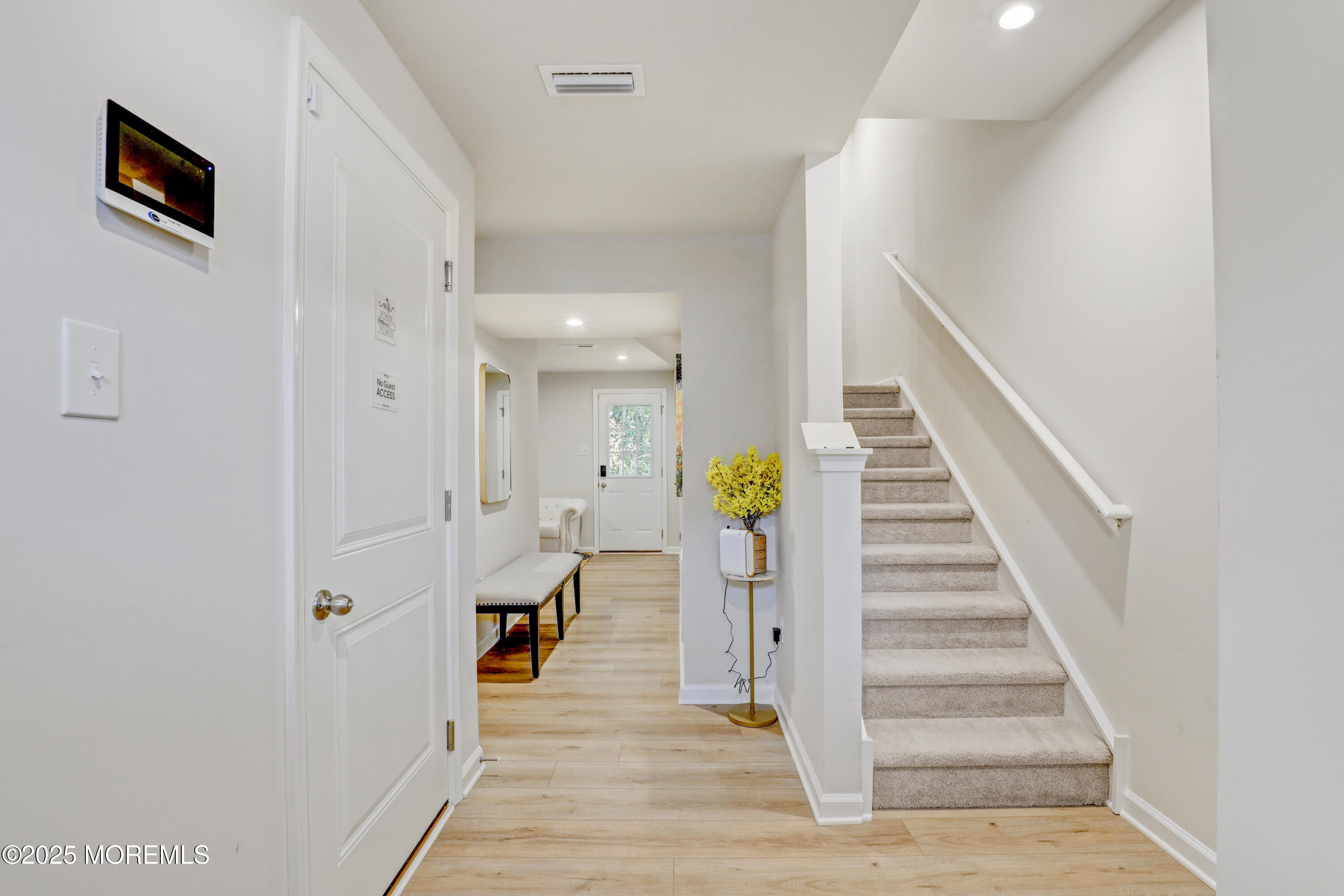 1001 Cypress Street Forked River, NJ 08731 - Photo 3 of 26 a very nice looking room with wooden floor and entryway