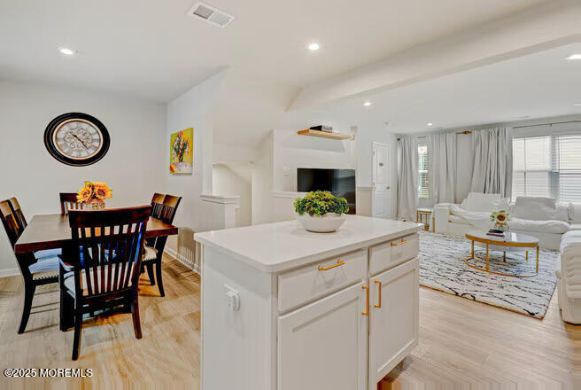 1001 Cypress Street Forked River, NJ 08731 - Photo 7 of 26 a view of kitchen island with furniture and wooden floor