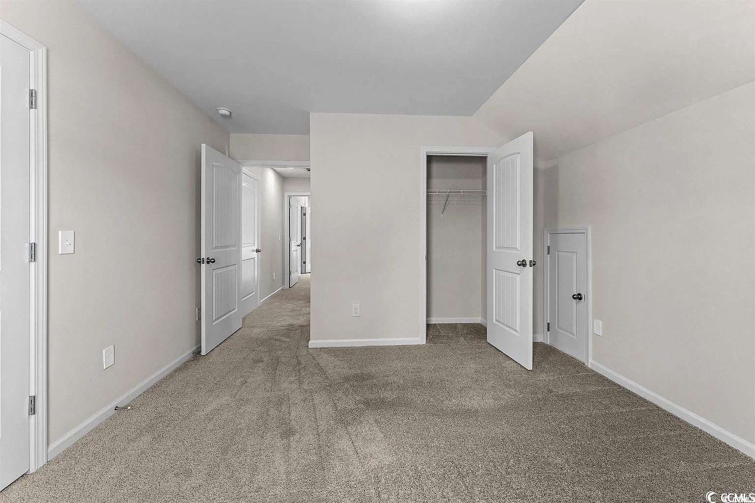 260 Red Maple Loop Longs, SC 29568 - Photo 11 of 34 Unfurnished bedroom with carpet flooring, a closet