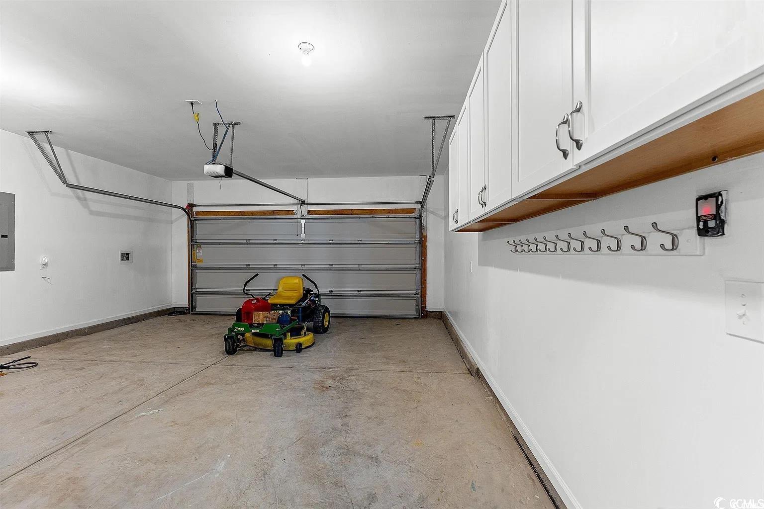 260 Red Maple Loop Longs, SC 29568 - Photo 12 of 34 Garage featuring electric panel and a garage door