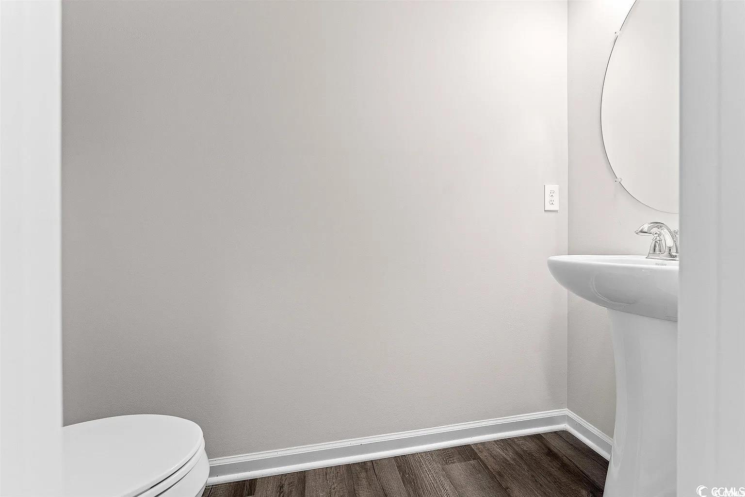 260 Red Maple Loop Longs, SC 29568 - Photo 14 of 34 Bathroom with sink, toilet, and hardwood / wood-st