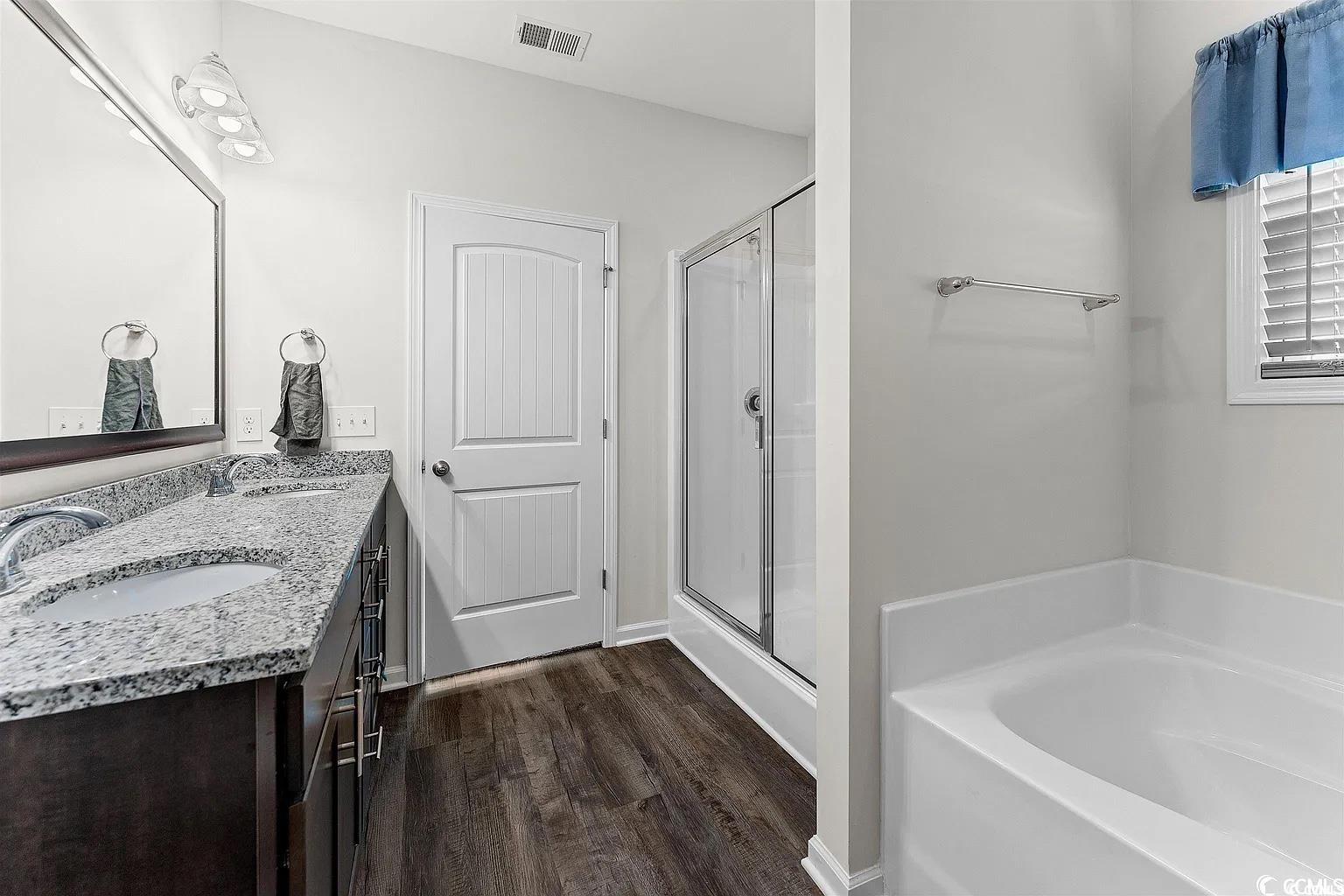 260 Red Maple Loop Longs, SC 29568 - Photo 16 of 34 Bathroom featuring hardwood / wood-style flooring,