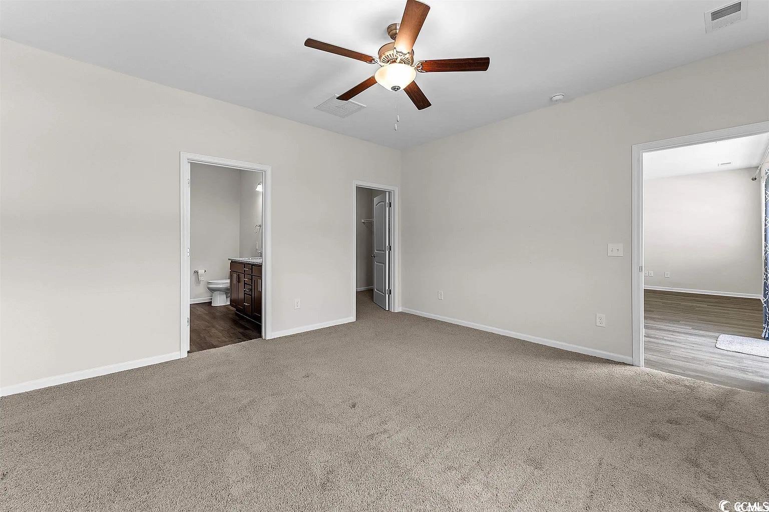 260 Red Maple Loop Longs, SC 29568 - Photo 19 of 34 Unfurnished bedroom featuring dark colored carpet,