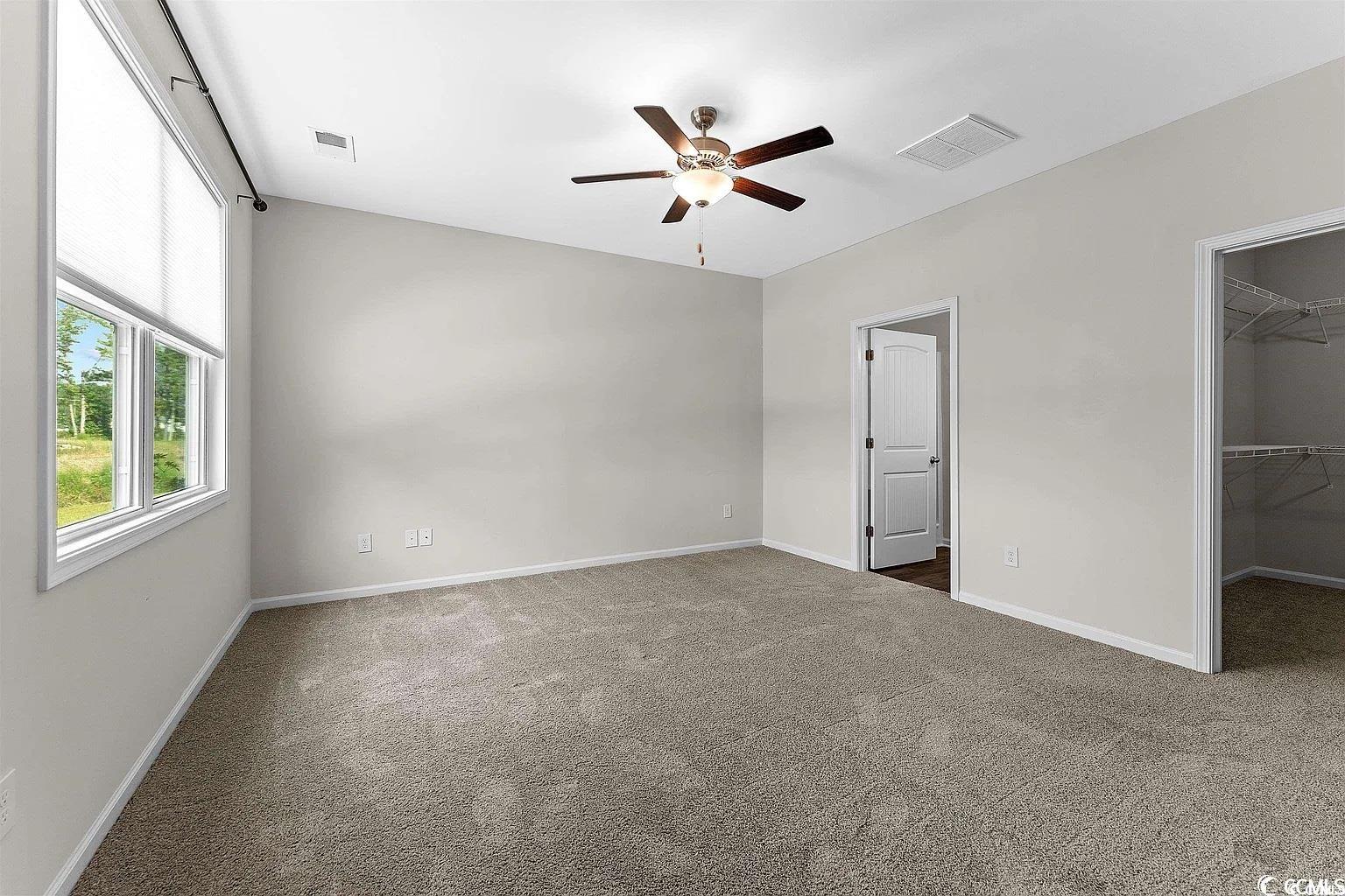 260 Red Maple Loop Longs, SC 29568 - Photo 20 of 34 Unfurnished bedroom with a spacious closet, a clos