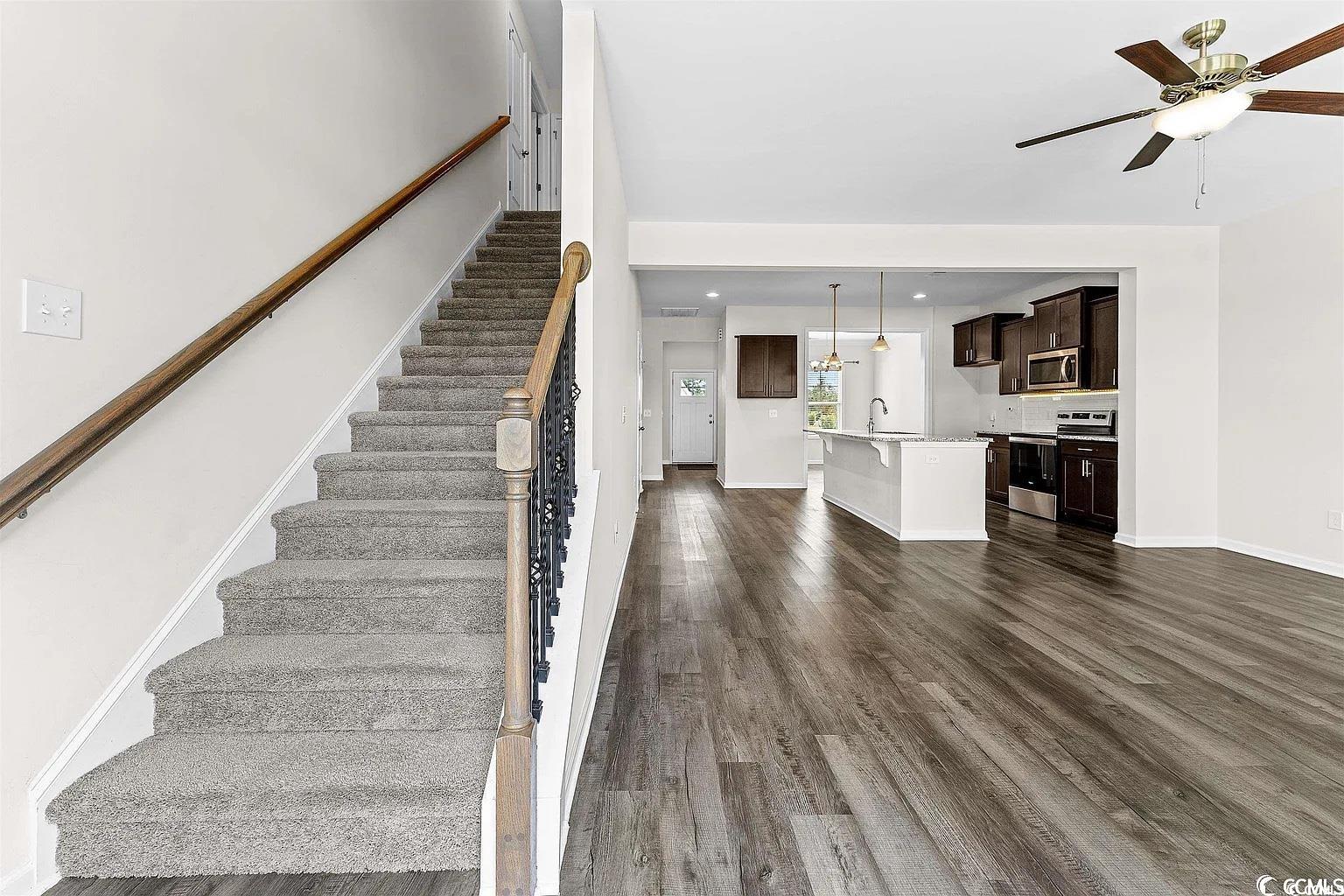 260 Red Maple Loop Longs, SC 29568 - Photo 22 of 34 Stairway with wood-type flooring, ceiling fan, and
