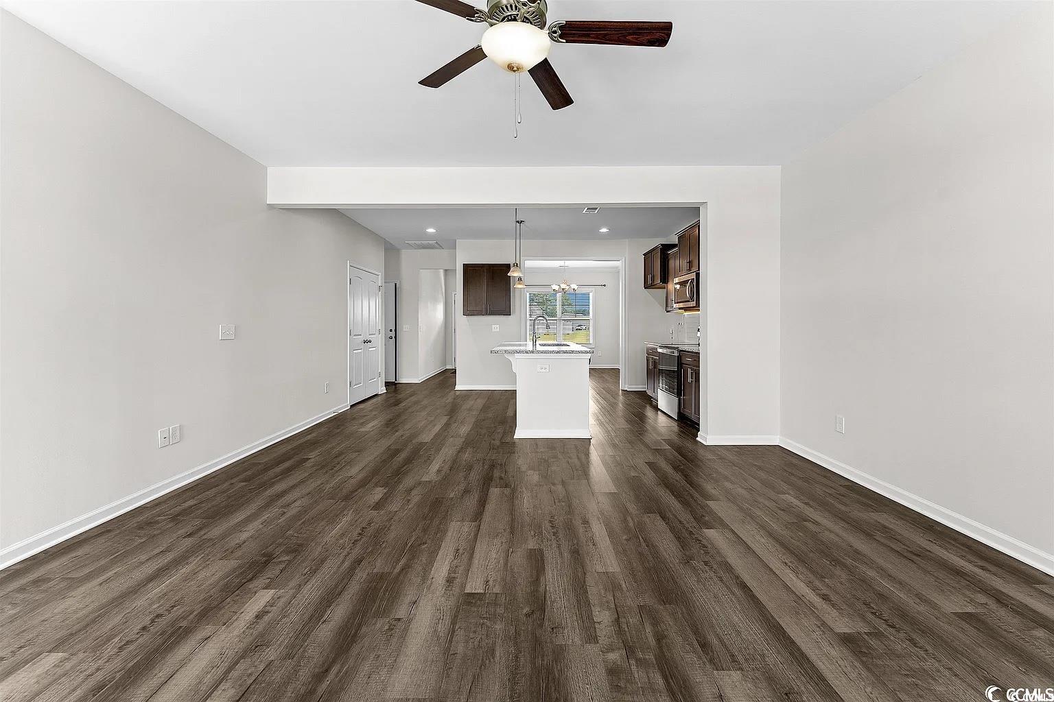260 Red Maple Loop Longs, SC 29568 - Photo 23 of 34 Unfurnished living room featuring ceiling fan, sin