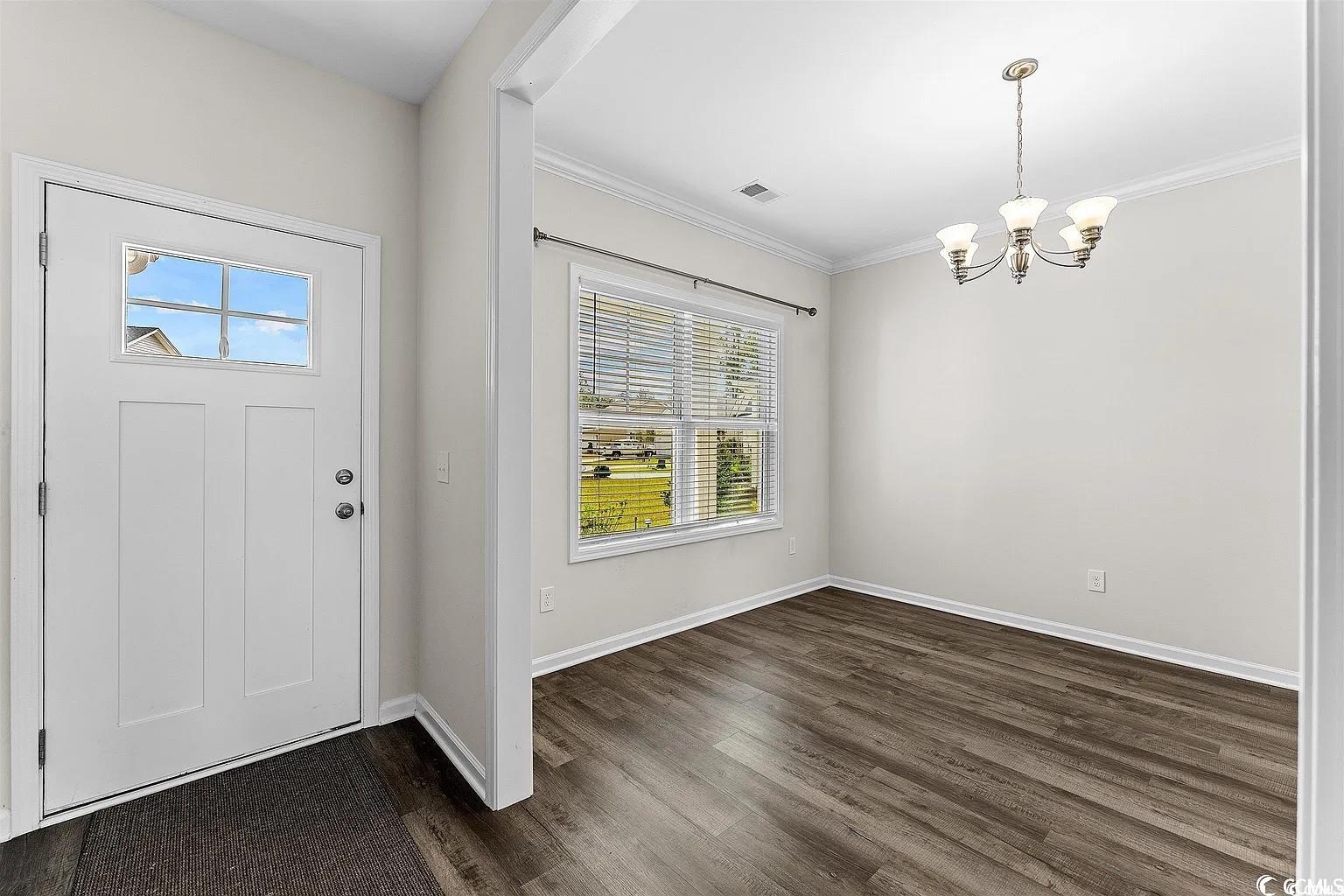260 Red Maple Loop Longs, SC 29568 - Photo 27 of 34 Entryway featuring a chandelier, dark wood-type fl