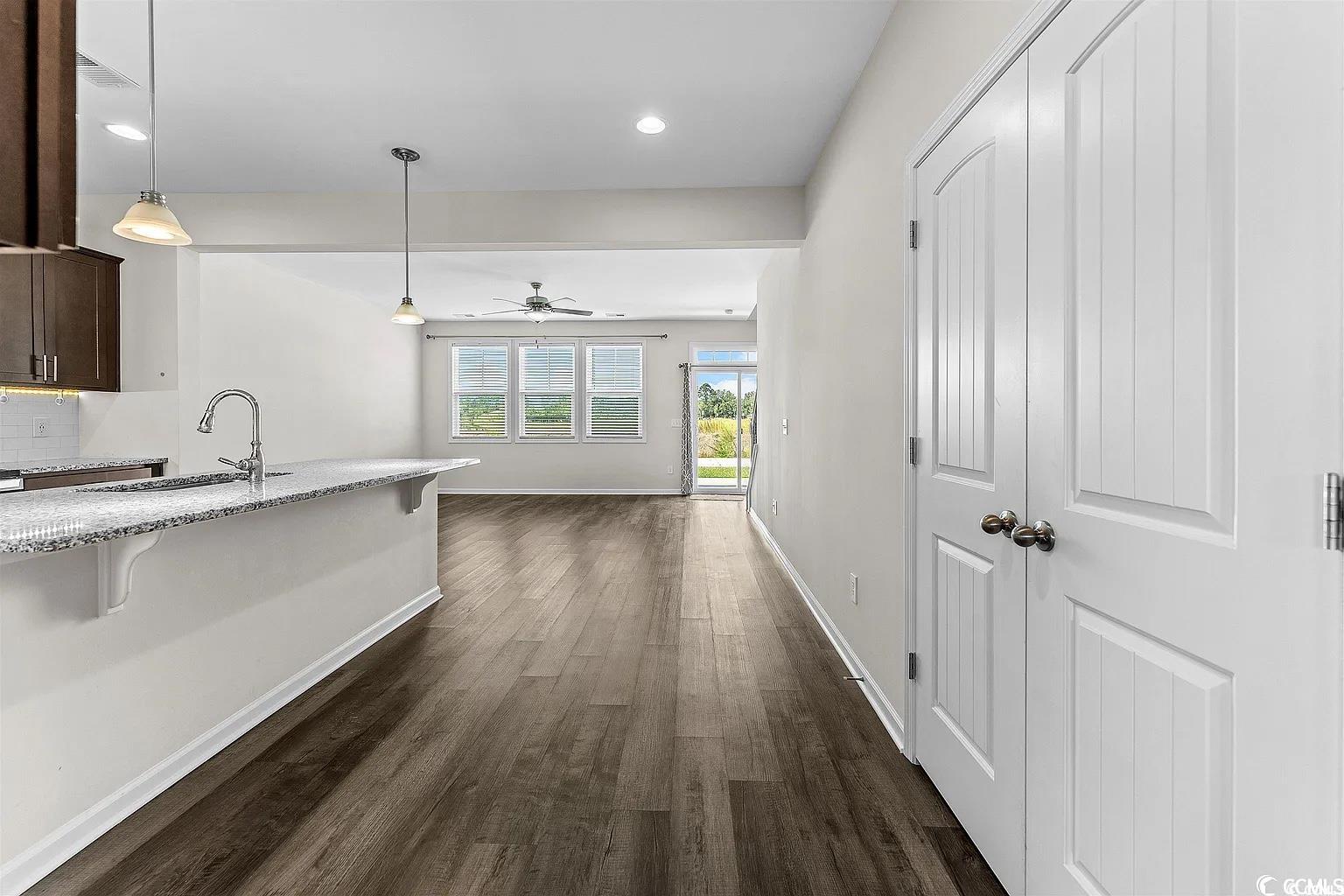 260 Red Maple Loop Longs, SC 29568 - Photo 28 of 34 Kitchen with dark wood-type flooring, sink, ceilin