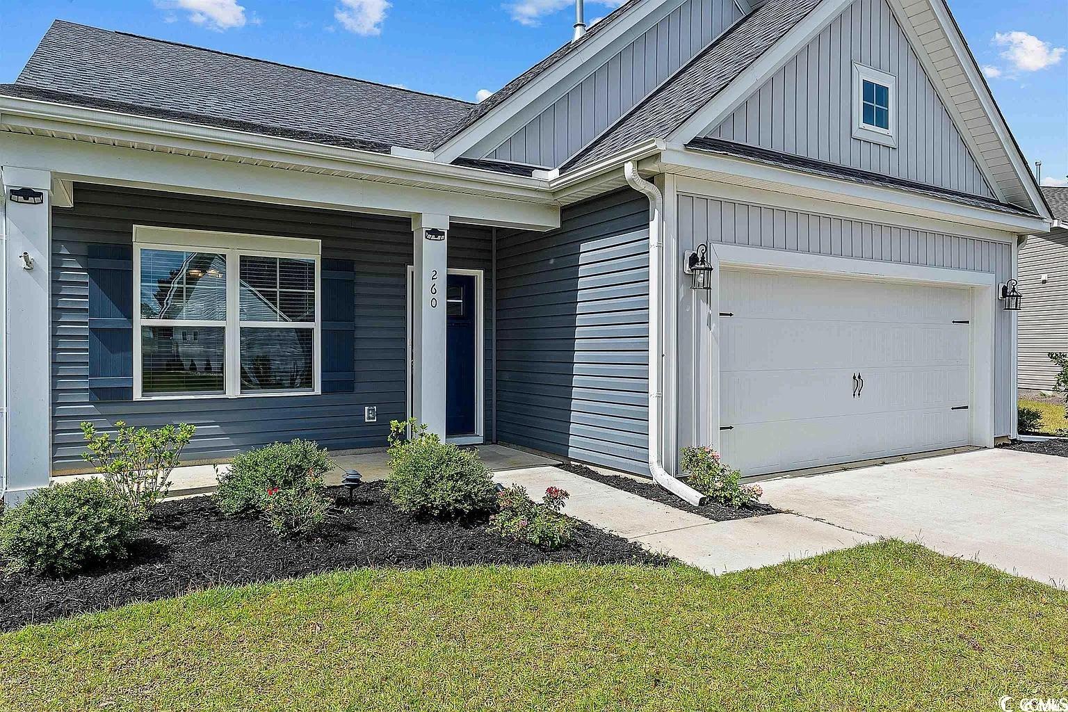 260 Red Maple Loop Longs, SC 29568 - Photo 3 of 34 View of front facade featuring a garage and a fron