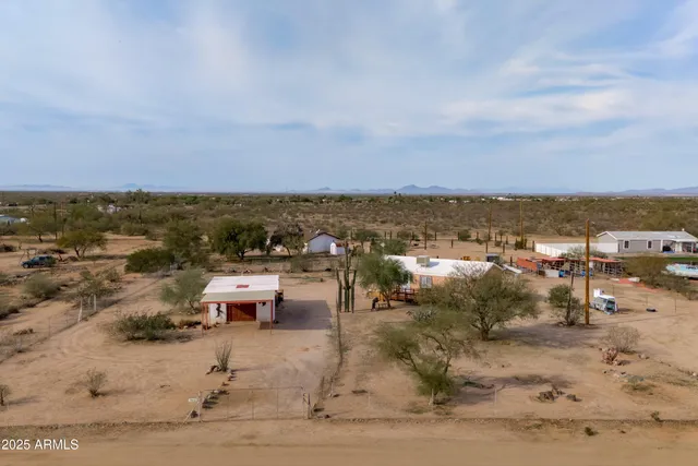 an aerial view of a city with ocean