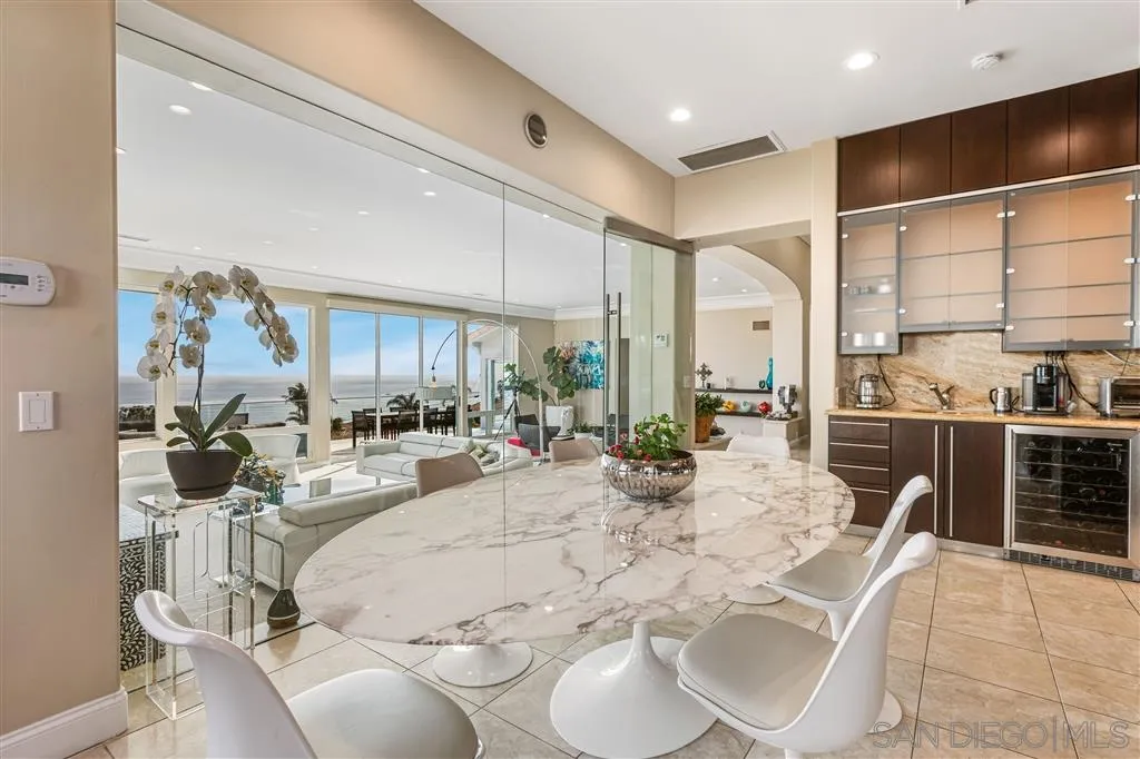 931 La Jolla Rancho Road La Jolla, CA 92037 - Photo 12 of 25 a view of a dining room with furniture