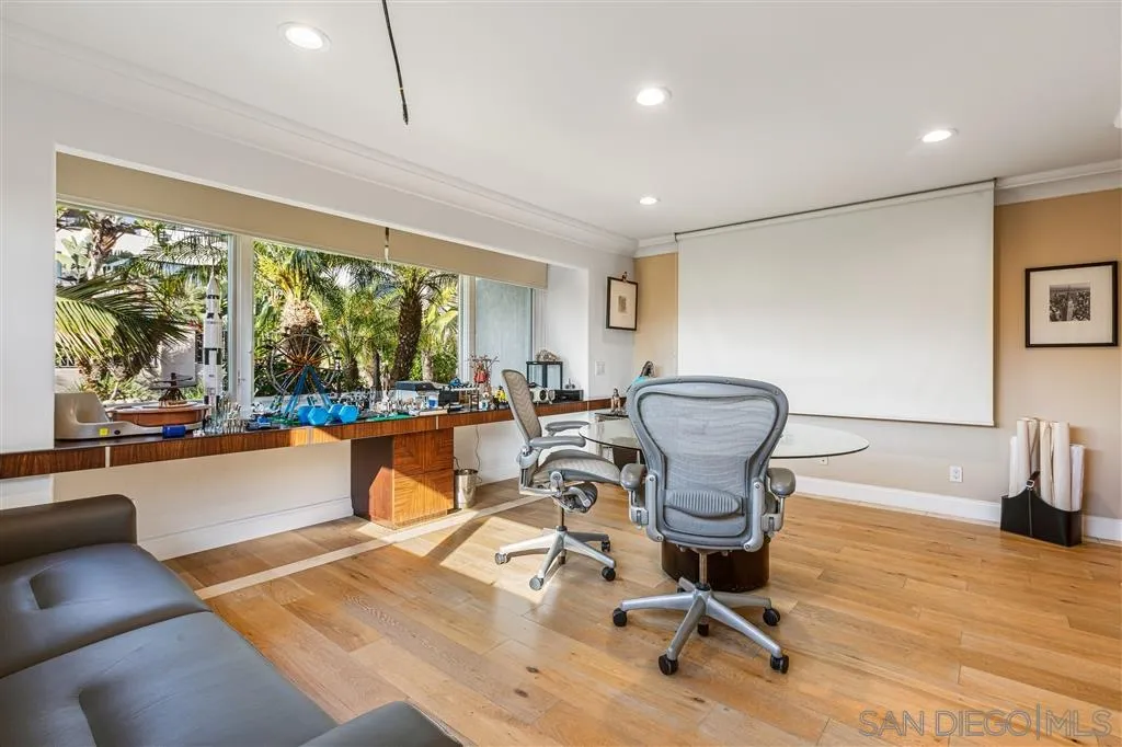 931 La Jolla Rancho Road La Jolla, CA 92037 - Photo 19 of 25 a living room with a large window and furniture