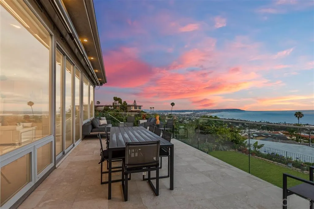 931 La Jolla Rancho Road La Jolla, CA 92037 - Photo 2 of 25 a view of a chairs and table in the balcony